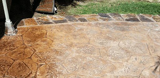 alt:"stamped-concrete-patio-cleaning-and-sealing."